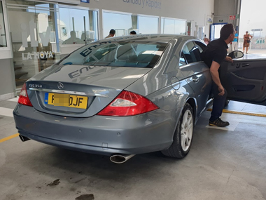 ITV inspector exits Mercedes CLS320 after successful brake test Mercedes CLS320 at ITV test centre